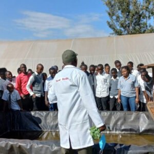 Students-receiving-training-on-modern-fish-farming Bathi students visit Wambugu Farm